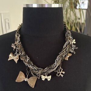 Statement Gold and Metal Bow Charm Necklace